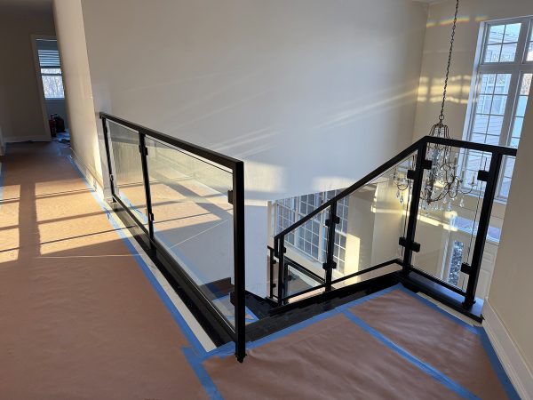 Staircase glass railing