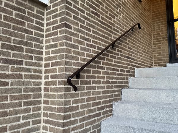 Molded steel handrail with flanges