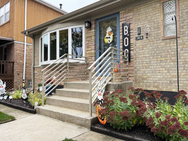 Exterior railings with wide rods. Painted Sandling