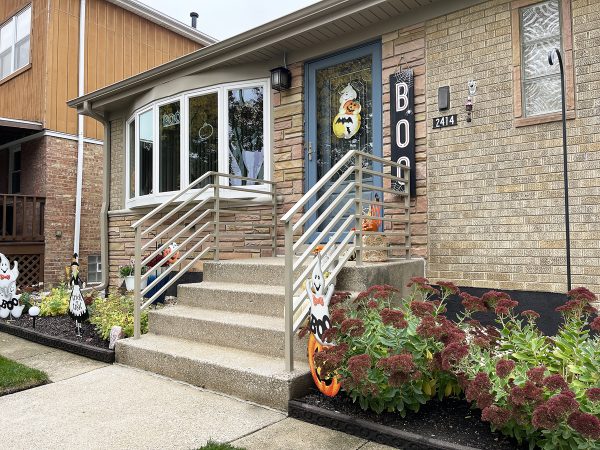 Exterior railings with wide rods. Painted Sandling