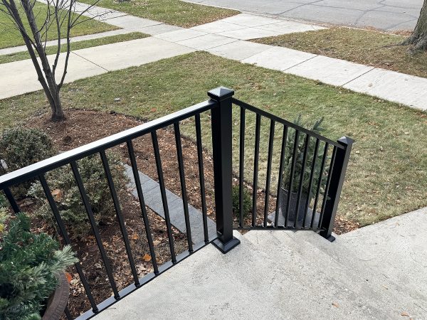 Exterior railings with large posts and caps