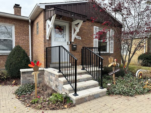 Modern railings with vertical pickets and post shoes