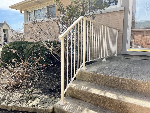 Custom railing with vertical pickets painted Light Cream