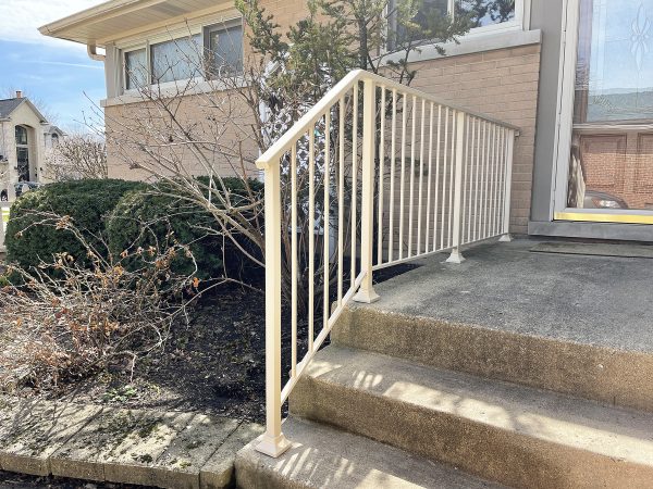 Custom railing with vertical pickets painted Light Cream