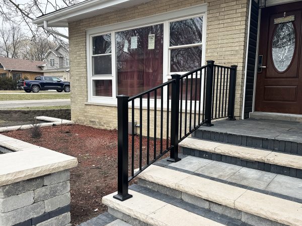 Exterior front porch railing with large posts and post caps