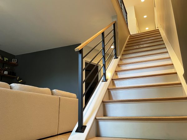 Black slim rod horizontal railing with sealed wood top