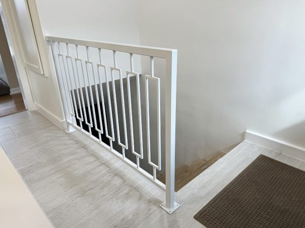 Interior white railing with custom rectangles