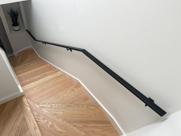 Custom flange handrail for wall