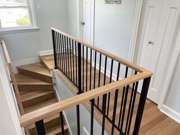 Vertical picket railing with wood cap