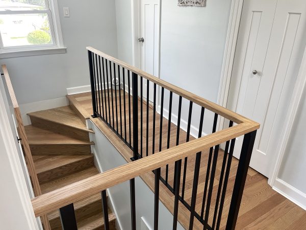 Vertical picket railing with wood cap