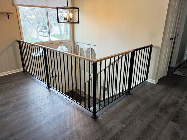 Modern railing with wood cap and a gate