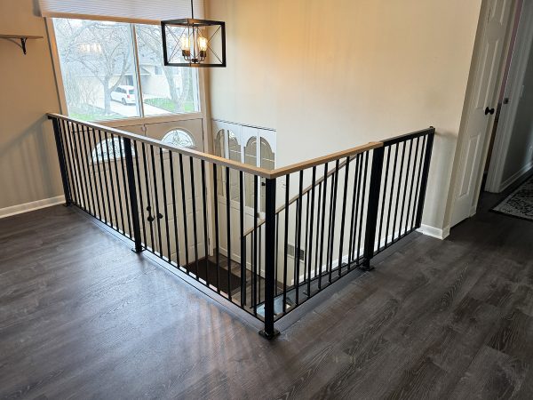 Modern railing with wood cap and a gate