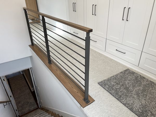 Interior horizontal railing with plate posts and oak wood top | Chicago Custom Railings