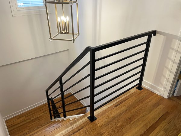 Interior staircase railing with horizontal bars