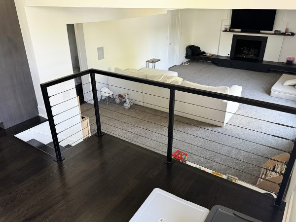 Interior railings with black cables and metal frame