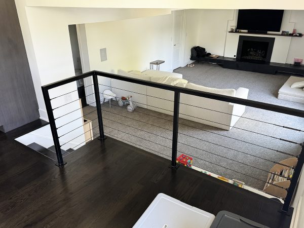 Interior railings with black cables and metal frame