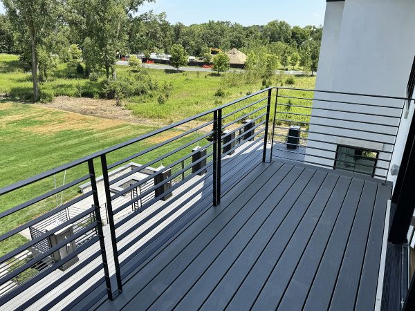 Exterior horizontal balcony railing with flat plates