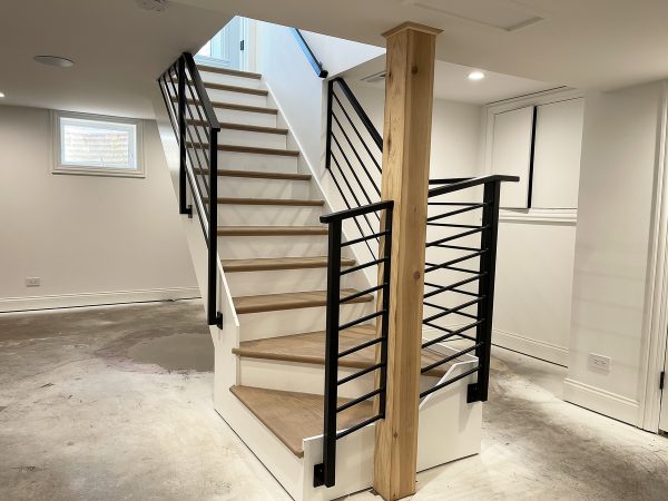 Slim rod railing with basement staircase