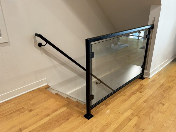 Interior glass railing with black brackets