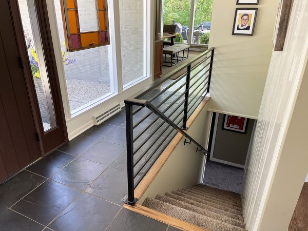 Interior railing with adjacent handrail
