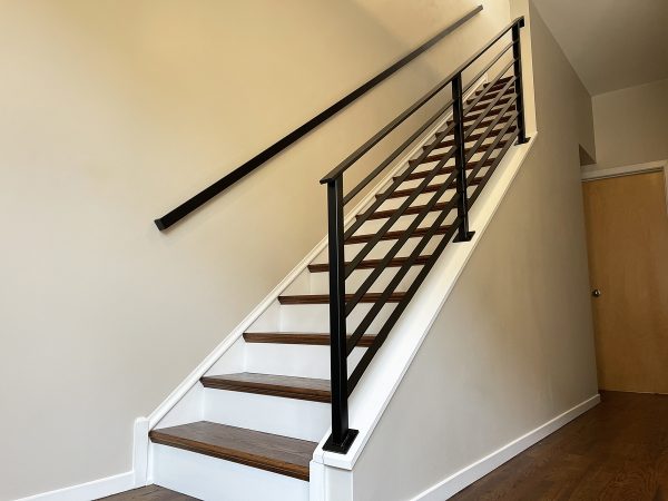 Interior custom railing with flat rods