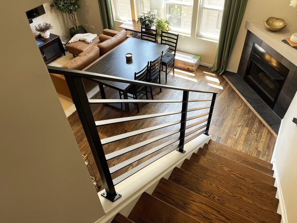 Interior stair railing with flat rods