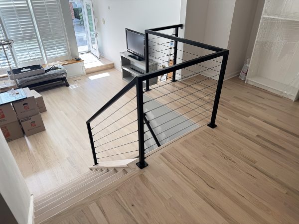 Interior cable railing with custom metal frame