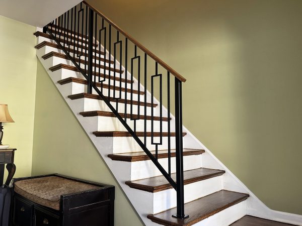 Interior railings with rectangular balusters and stained oak top