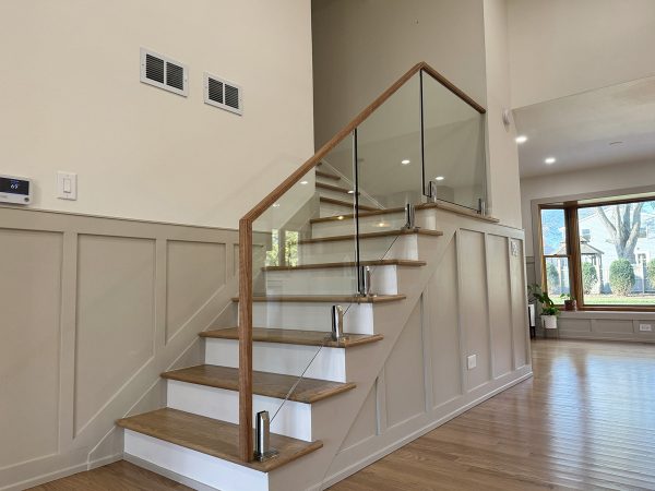 Transparent glass railing with wood frame