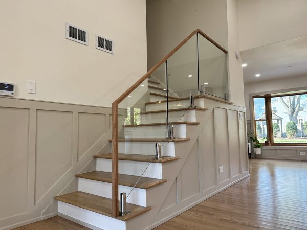 Transparent glass railing with wood frame