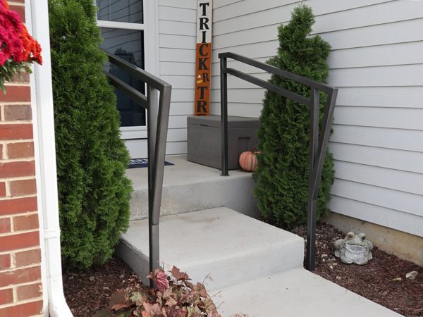 Double top handrails with custom front piece. Graphite