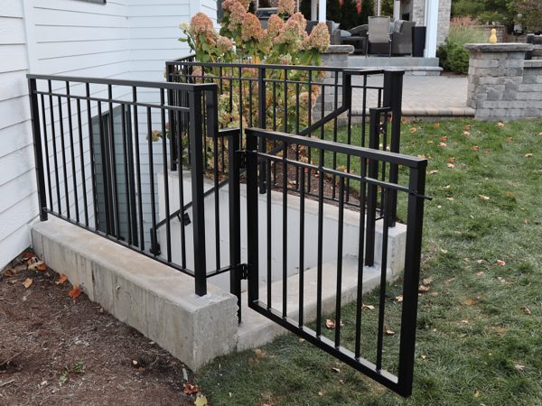Vertical picket railing with middle channel and gate | Best Chicago Railings