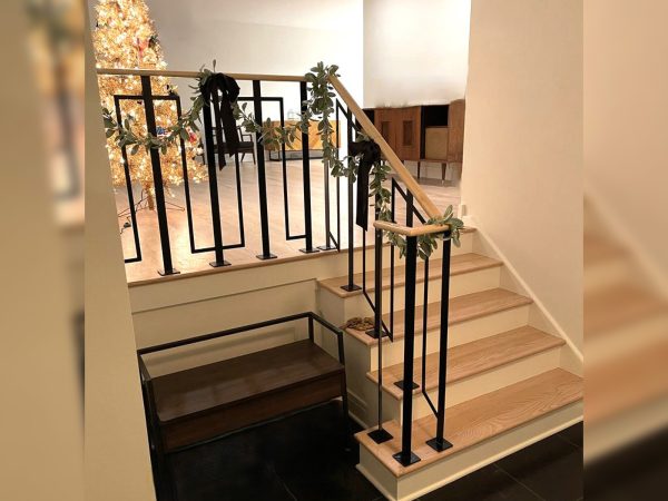 Interior custom railing with a squared zig zag pattern and wood top | Best Chicago Railings